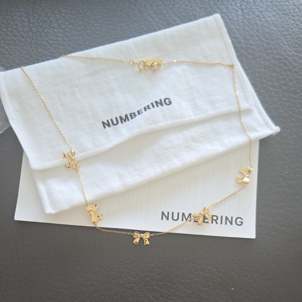 Gold Bow Necklace by Numbering